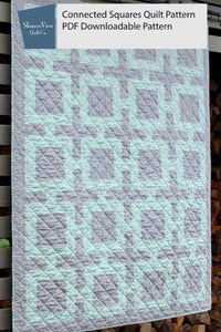 Image of a Shinersview connected squares quilt pattern in gray and light green