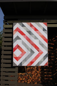 HST Baby quilt with coral and gray
